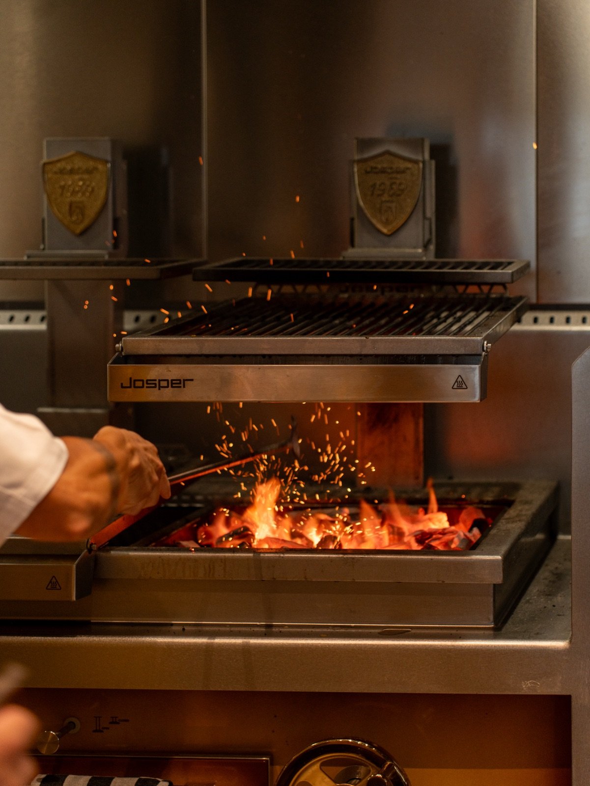 Flames and sparks on the charcoal grill