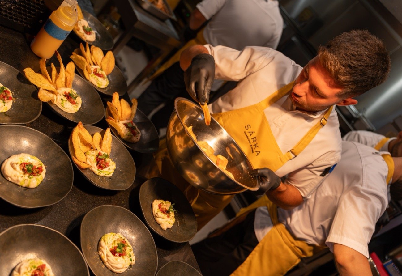 A SÁRKA chef plating dishes during service